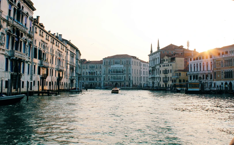 a boat on the water and a city in the background