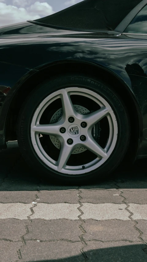 car tire next to the curb, a car has been parked