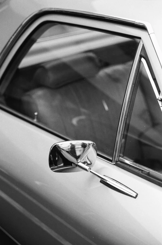 the door handle on a car has a chrome finish