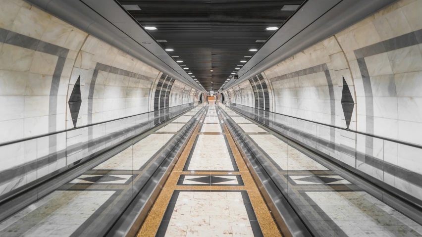 an overhead walkway has a tile floor and yellow lines