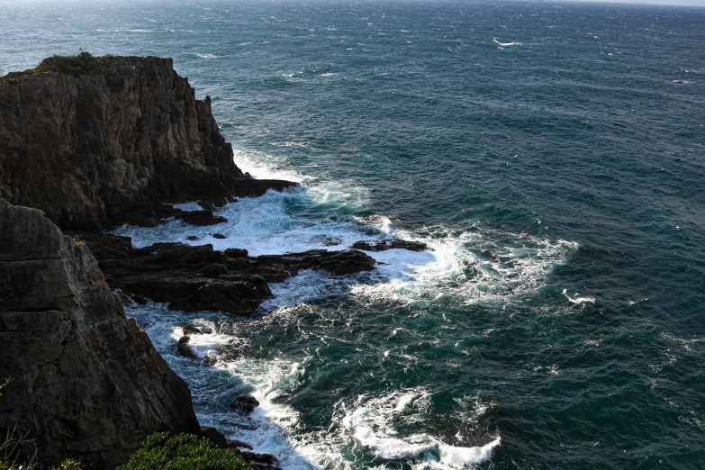 the ocean and mountains are seen from above