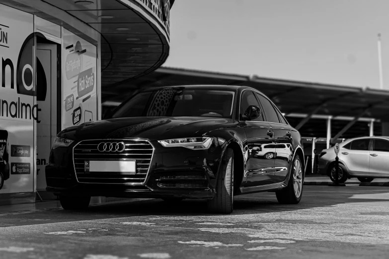 a pair of cars parked next to a building