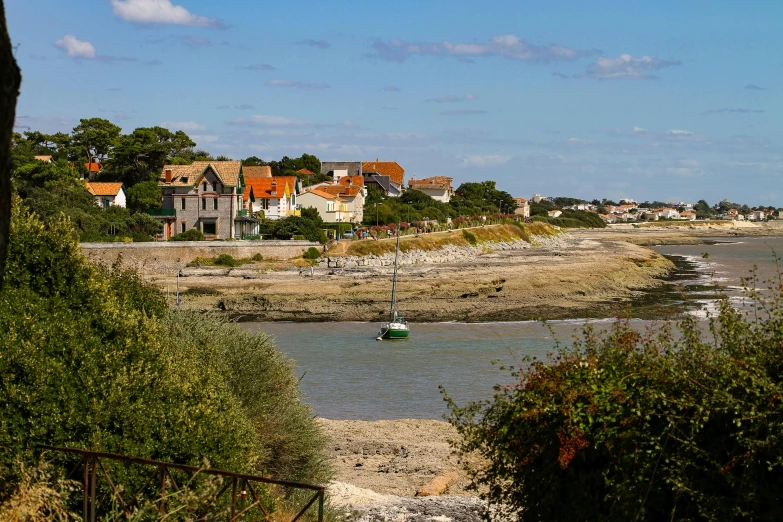 some boats on the water and houses