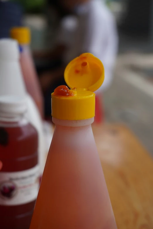 a bottle with orange juice in the middle