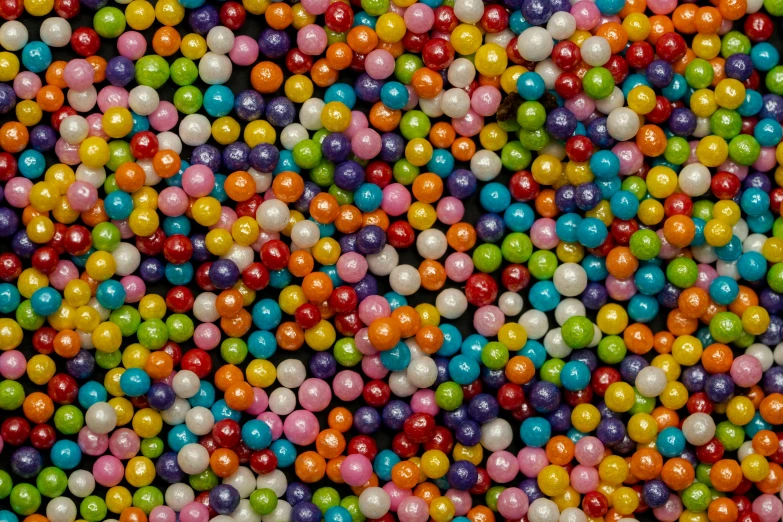 many different colored balls and small objects are in the same amount