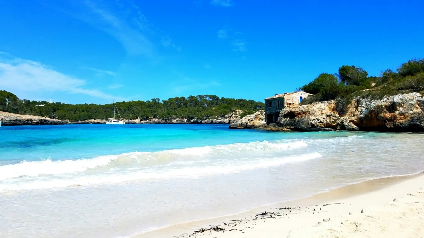 an image of blue ocean with white sand