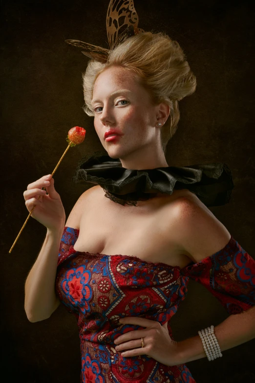 woman in red and black dress holding a rose