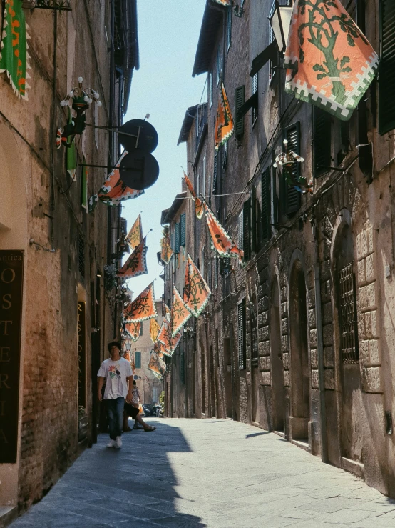 this is an old european street with flags