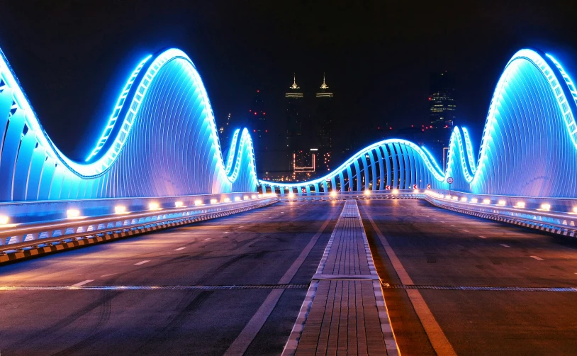 a large lighted bridge with lights and lights on top