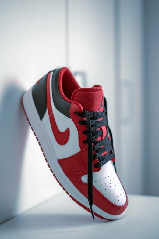 the nike air jordan 1 retro is made with red, grey and white