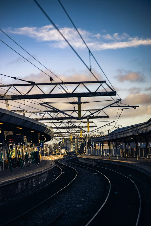 the train tracks run parallel to a platform