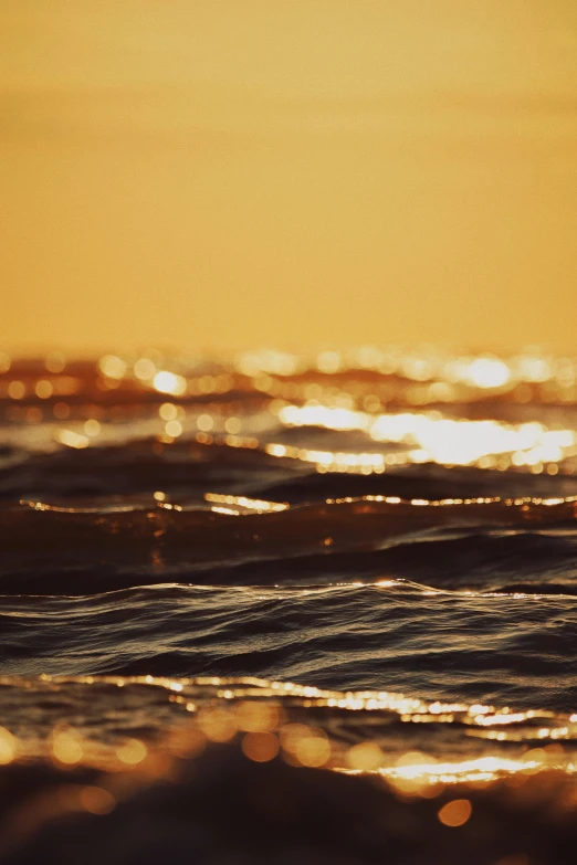 an ocean with a surfer riding the waves