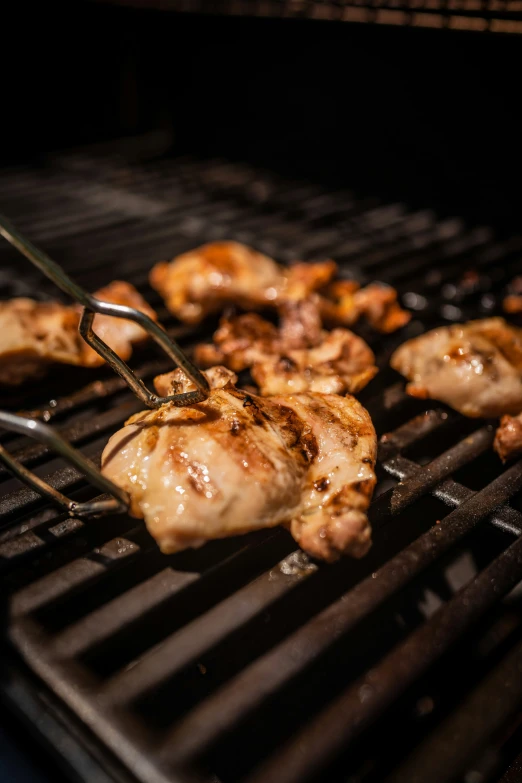 chicken on the grill being prepared to be served