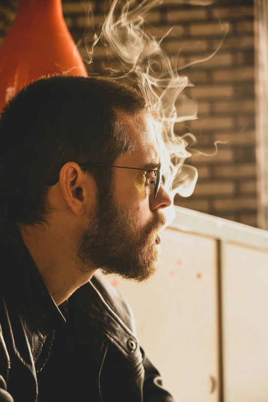 a man with smoke coming out of his hair