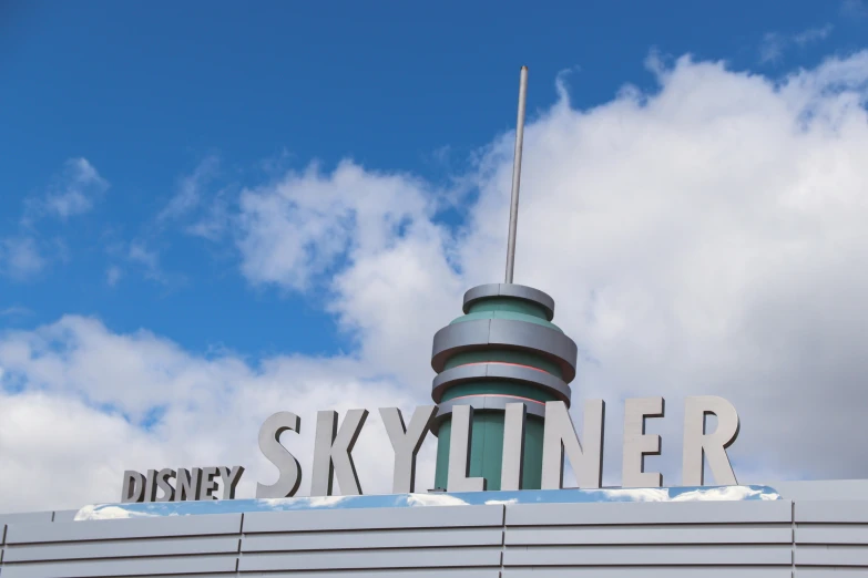 a skylinkr sits atop the sky and says disneyland skyliner
