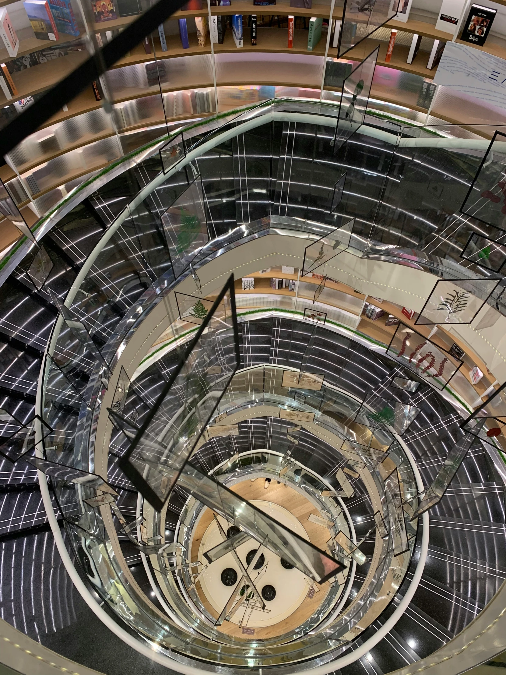 an escalator in an airport filled with furniture