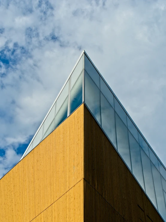 a yellow building is shown against the blue sky