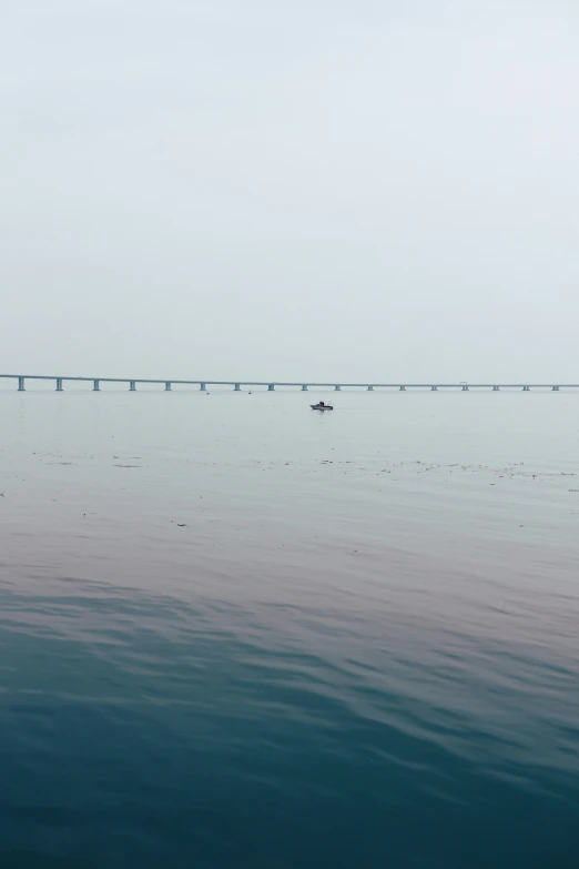 a sailboat floating across a body of water