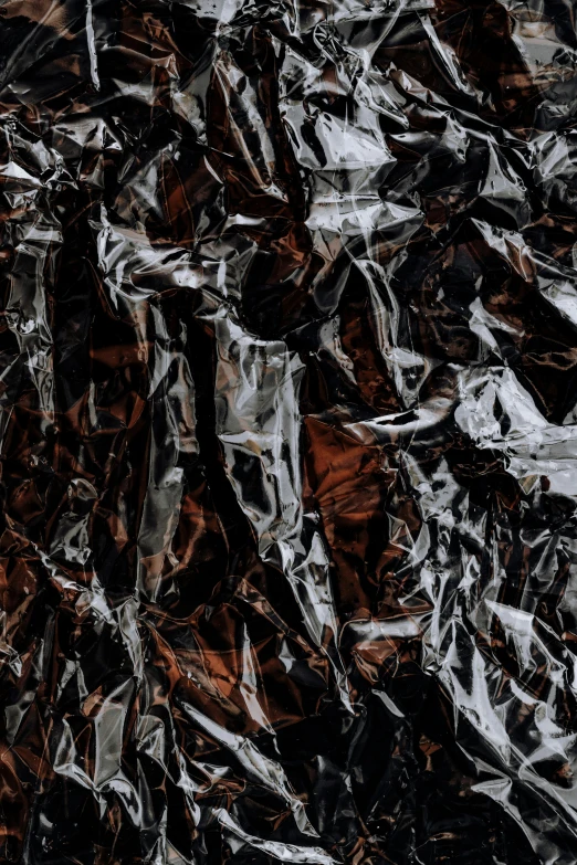 the pograph shows a dark background covered in tin foil