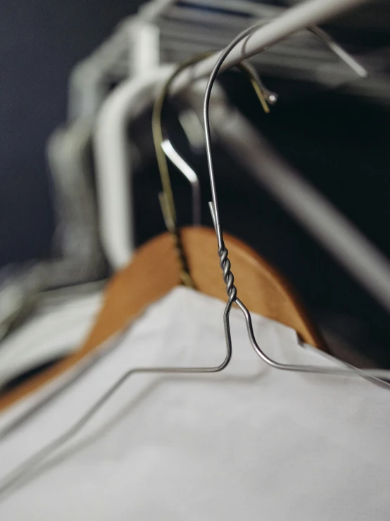 a white shirt with a metal stitched design