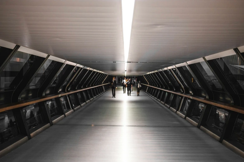 a hallway that leads into an elevator and looks like it could have a bridge over it