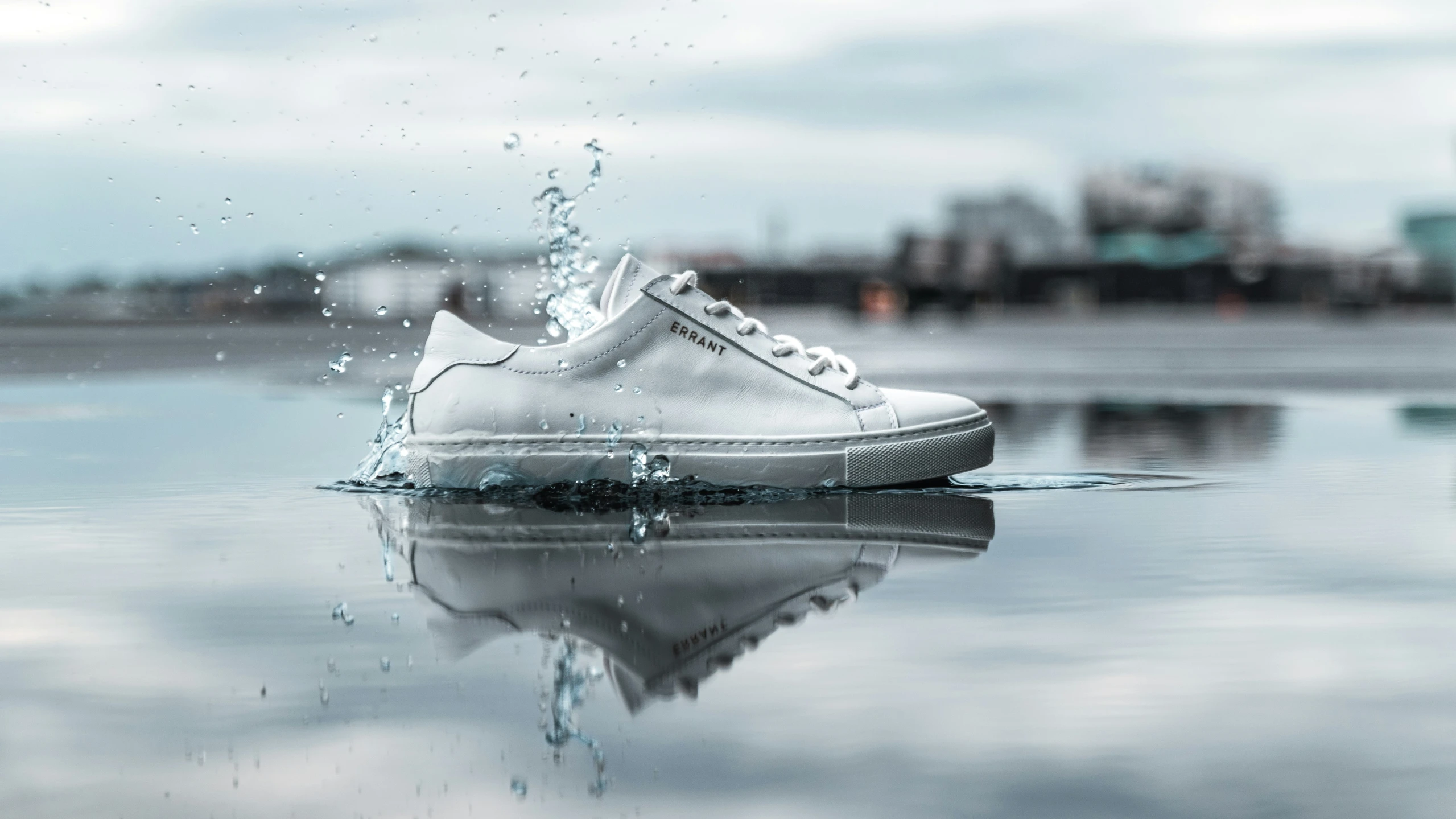 the sneakers with the high top are reflected in a pool