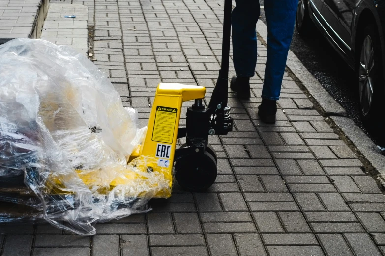 some plastic bags and an electric street scooter