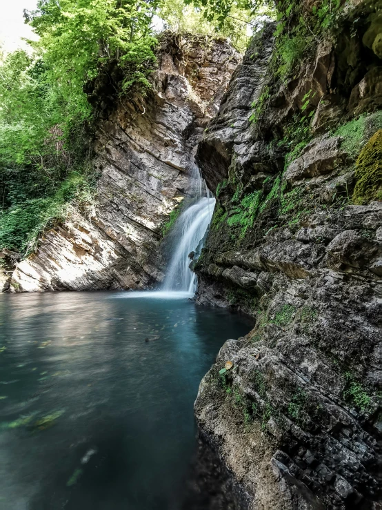 a waterfall in the middle of an open field