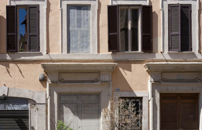 this is a house with wooden doors and windows