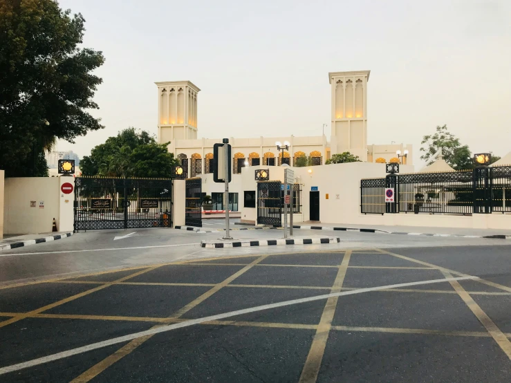 an empty street with a gate in front of it