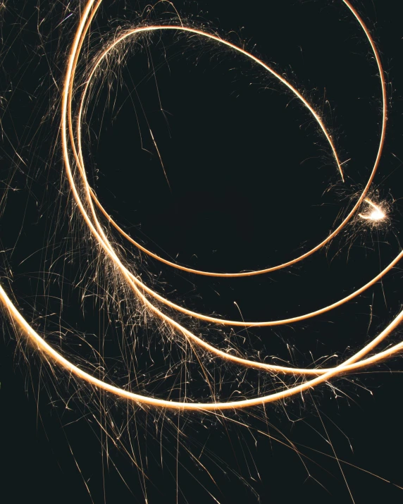 a circle made out of yellow sparkler cords