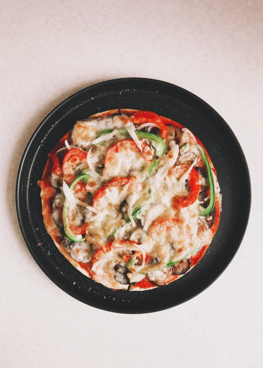 a pizza sitting on top of a pan on top of a table