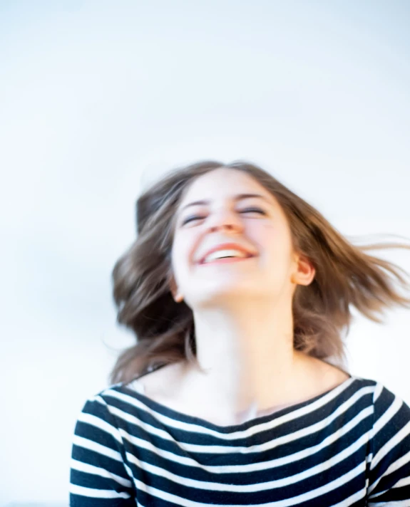 a woman smiling with a happy look on her face