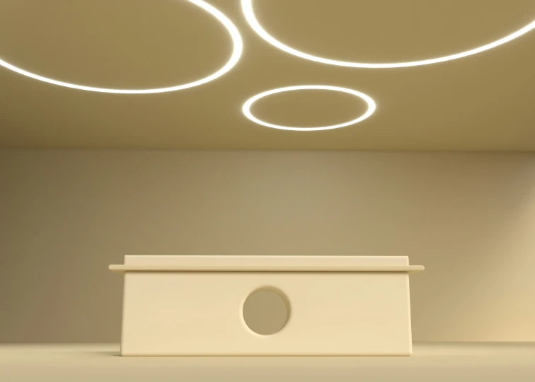 an empty room has an unusual white table and some lights on the ceiling