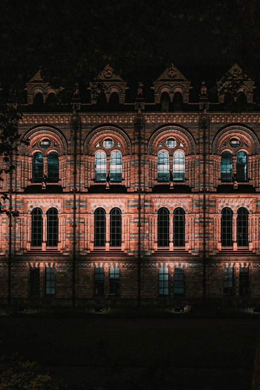 a building that is next to some water at night