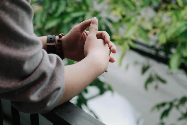 a person on a bench holding the hand of another person