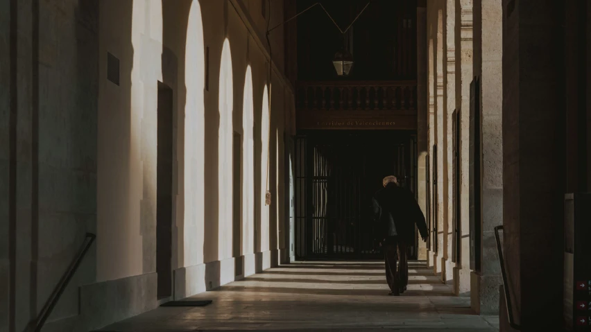 a person is walking down an alley way