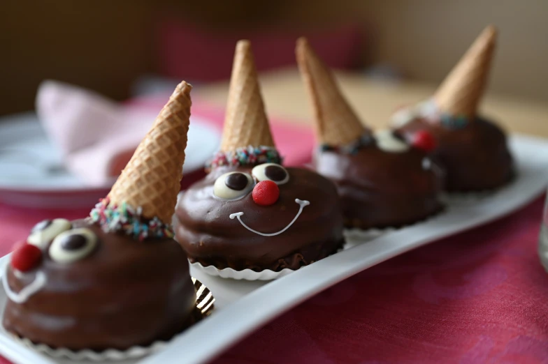 chocolate candies with decorations and decorated ears on top