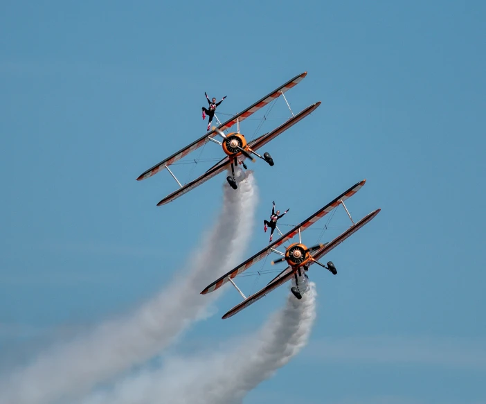 there are four planes that are flying in the sky