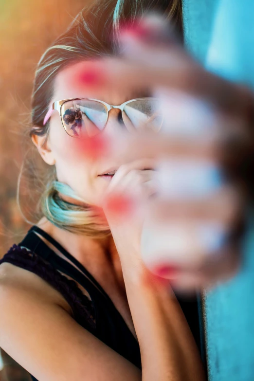 young woman looking at herself with a weird look