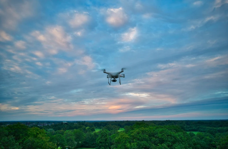 the large white airplane is flying high in the sky