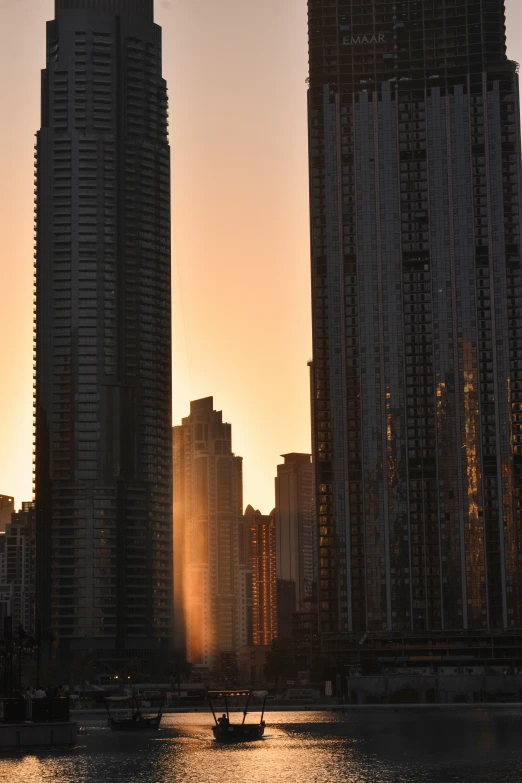 some tall buildings and boats in the water