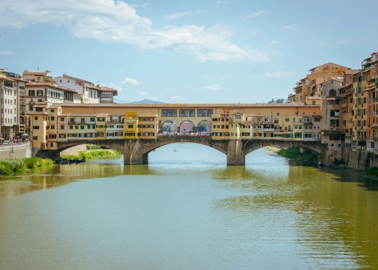 a bridge with some buildings in the distance