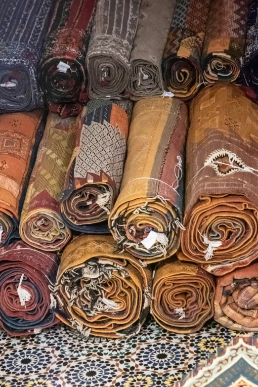several rows of different colored and patterned carpet