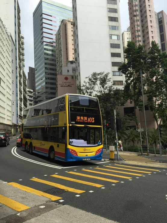 a double decker bus travels through a city