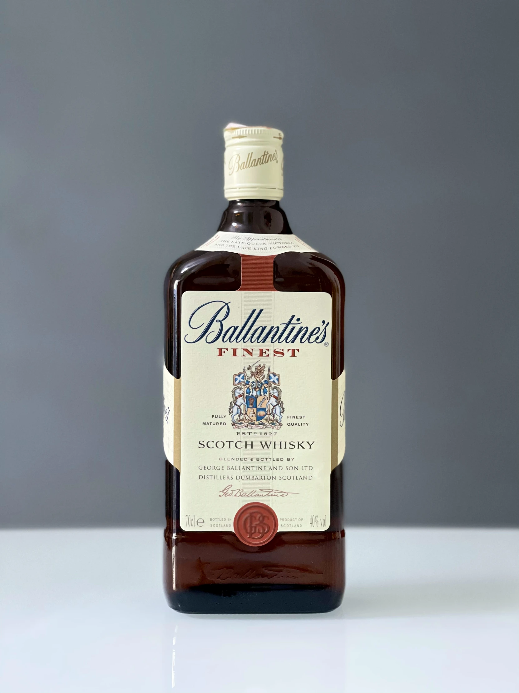 an old fashioned ballantine bottle sitting on a table