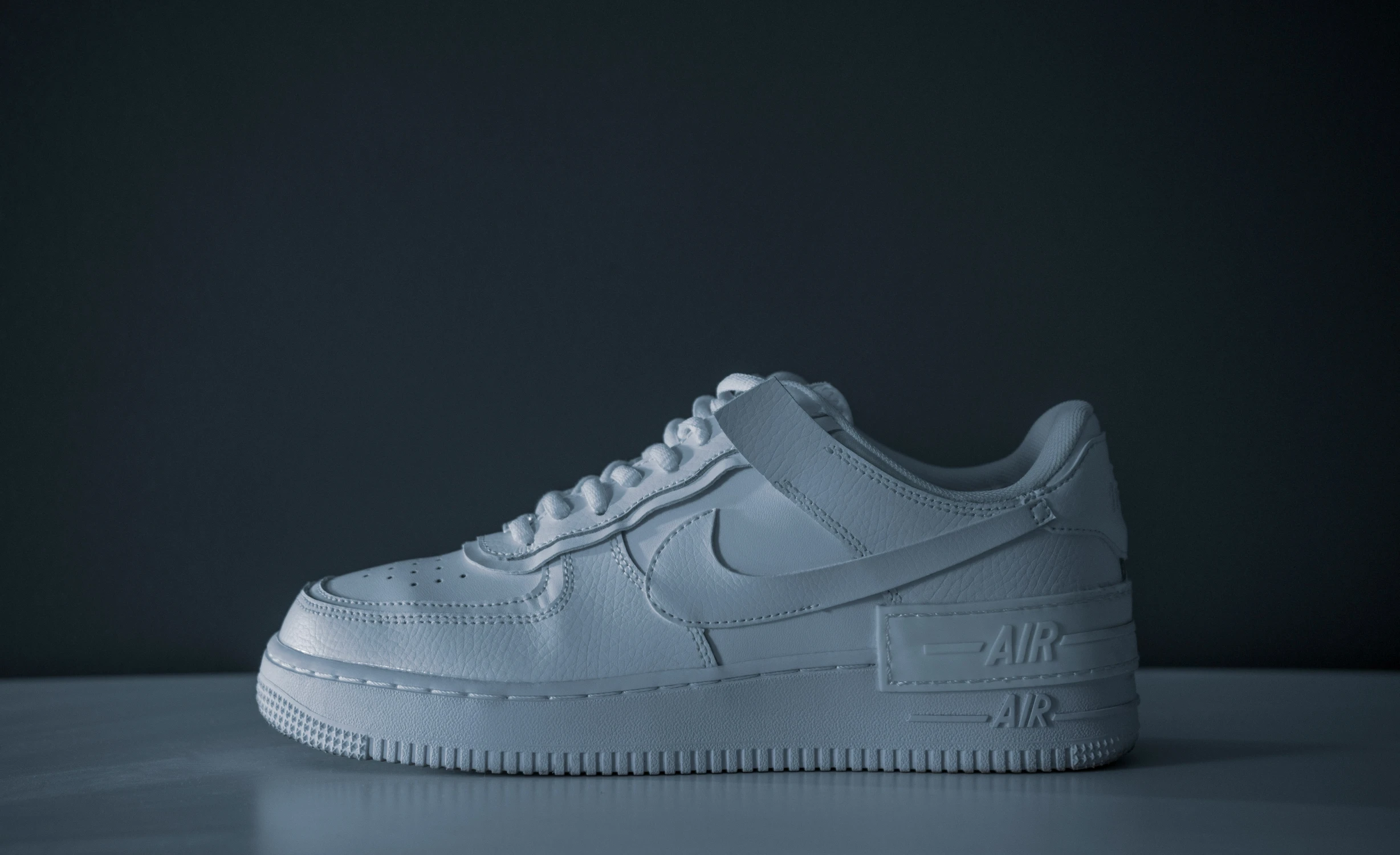 a white nike air force low top sneakers
