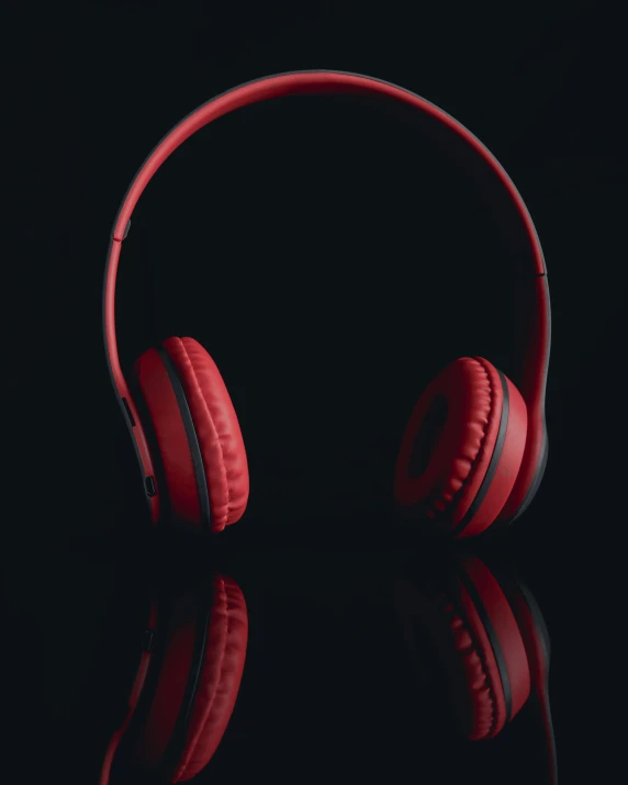 the red headphones is reflected in the water