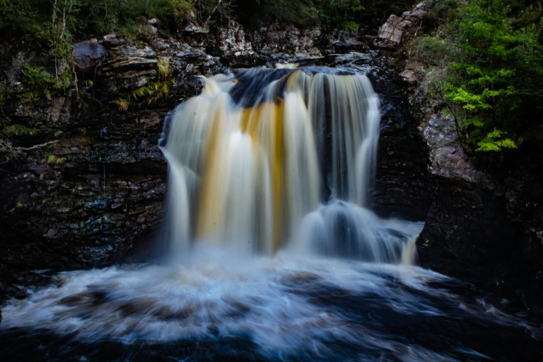 there is a very pretty waterfall in the woods