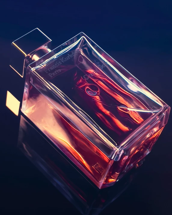 a clear square container containing orange and red items